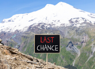 Last chance symbol. Concept word Last chance on beautiful black blackboard. Beautiful stone...