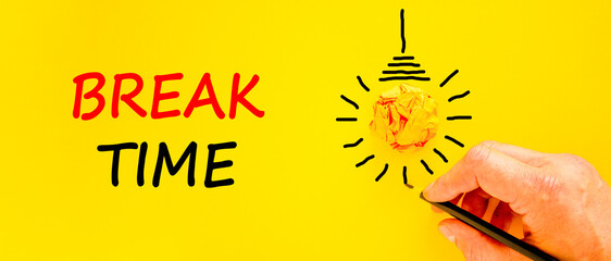Break time symbol. Concept word Break time on beautiful yellow paper. Businessman's hand. Light bulb icon. Beautiful yellow paper background. Business break time concept. Copy space.