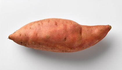 top down flat lay of a sweet potato against a white backdrop