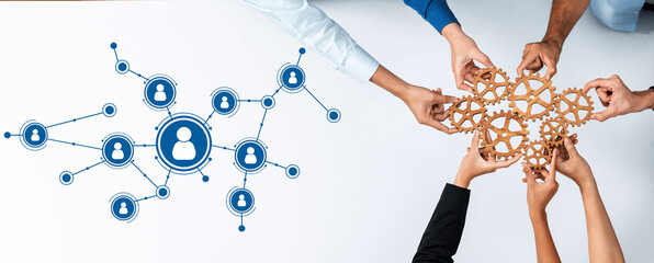 A dynamic scene featuring multiple hands collaborating on a networking project. Interconnected...