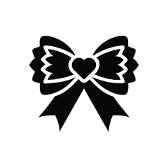 Decorative black ribbon bow with a heart in the center isolated on white background isolated on transparent background