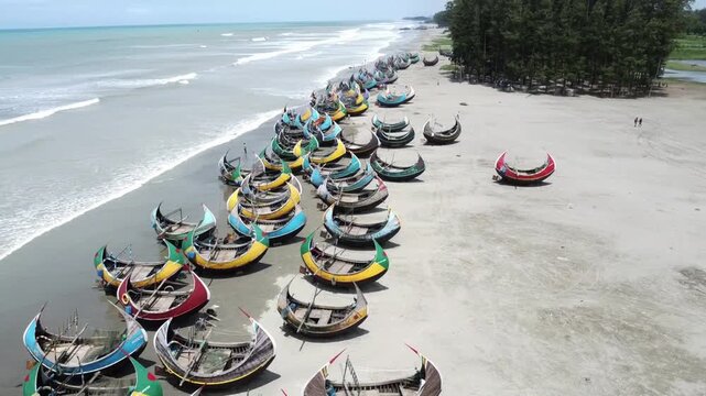 Traditional Wooden Fishermen's fishing boat, Teknaf Coxs bazar, Bangladesh. Colorful Wooden Fishing Boat On a Cox's Bazar Sea Beach With Blue Sky Background in Bangladesh.Beautiful Bangladesh Photo.