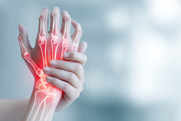 Hand experiencing joint pain, with red highlighting the inflamed bone structure, indicating arthritis.