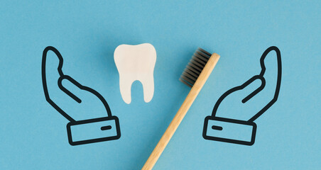 A toothbrush and toothpaste are shown with a hand holding the toothbrush