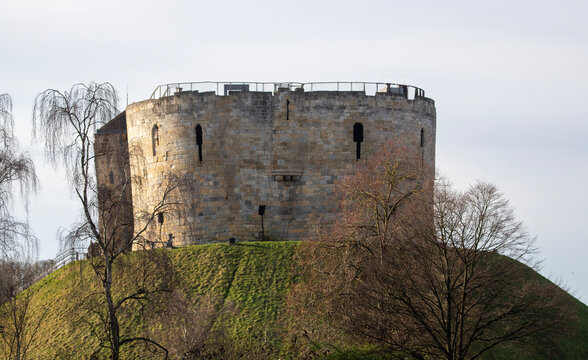 Clifford's Tower, York. The last part of York Castle  built by William the Conqueror about 1068. The original wooden structure burnt down in1190, the present stone tower was built in the 13C 