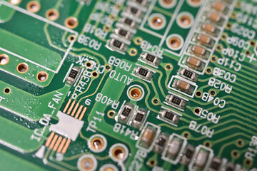 Close-up of small powered resistors on a printed circuit board.
