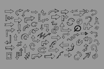 A diverse collection of hand drawn arrows in various styles and directions on a gray background