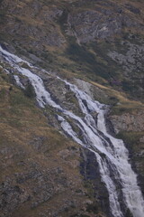 Obraz premium waterfall in tignes 1800, french alps, france