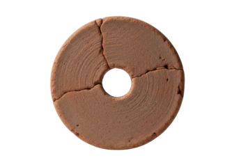Weathered clay disc, muted terracotta, central aperture, rough texture, against transparent background with copy space, soft studio light, ancient artifact concept