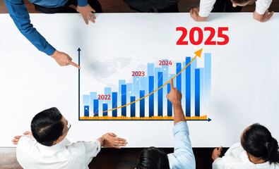 A dynamic business meeting scene, featuring a growth chart from 2022 to 2025. Team members analyze...
