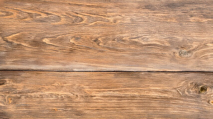 Fototapeta premium Brown wood shows rustic texture. Grain shines in soft light for a product backdrop, wallpaper or design template.