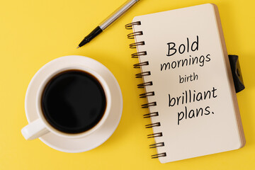 Coffee Pen and Notebook with Quote on Yellow Background