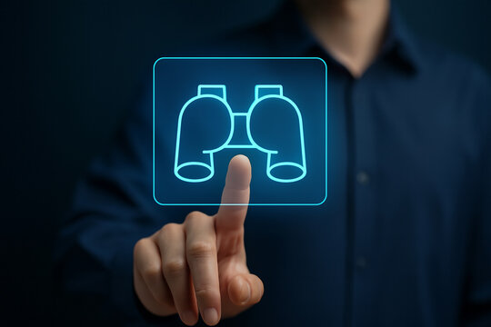 Photo realistic close up hand touching glowing holographic binoculars icon digital interface futuristic technology concept for professional commercial design use - Powered by Adobe