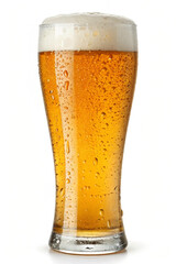 Tall glass of golden lager beer with frothy head and bubbles