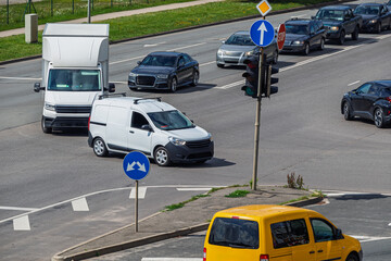 View of an intersection during heavy traffic, where cars are making a left turn