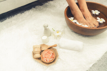 Panorama top view woman indulges in blissful foot massage at luxurious spa salon while masseur give...