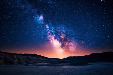 The sky is filled with stars and a large, glowing cloud of milk