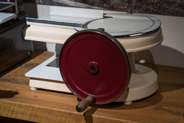Old type of slicer machine for cutting sausages.
