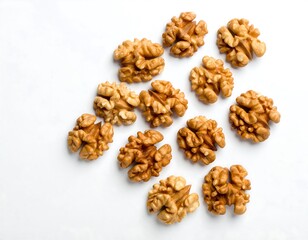 Walnuts arranged on white surface
