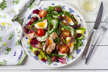 Mediterranean Tuna Salad on white plate. View from above