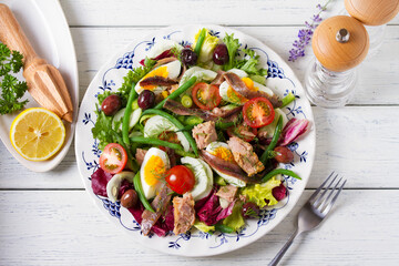 Mediterranean Tuna Salad on white plate. View from above