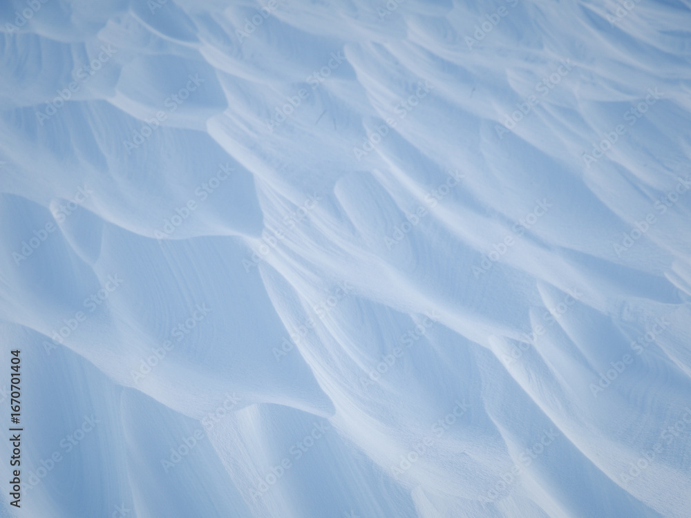 Sticker snow texture. wind sculpted patterns on snow surface. wind in the tundra and in the mountains on the