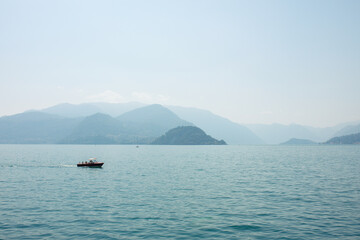 Serene lake view with mountains and boat