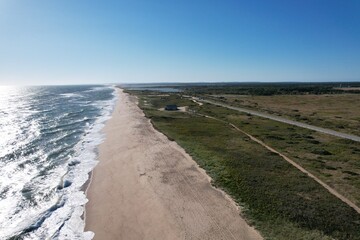 Aerial view of a long empty beach on the island of Marthas Vineyard