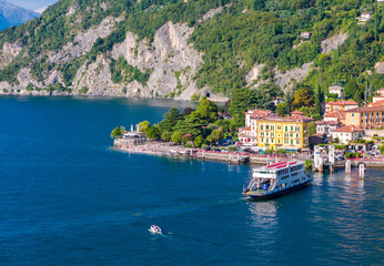 Como lake ferry boat, Lombardy, Italy. Aerial panoramic drone view of ship sailing between...