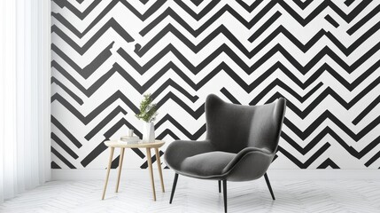 Gray armchair with small table and plant against black and white zigzag patterned wall