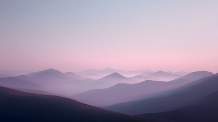 Fototapeta premium A tranquil vista of softly hued mountains, bathed in the soft light of dawn.