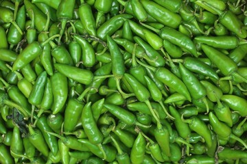 Shishito peppers or chilli peppers in the background