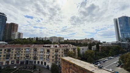 Fototapeta premium Architectural contrast in Kyiv — modern skyscrapers next to old historical buildings
