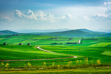 Puglia countryside landscape, view of rolling hills and a road near Poggiorsini, Italy