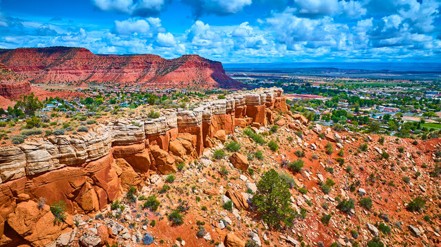 Aerial Red Rock Formations and Kanab Utah Desert Town with Green Valley