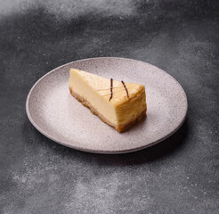 A piece of sweet New York cheesecake, dessert, cheese and vanilla pie. Classic cheesecake