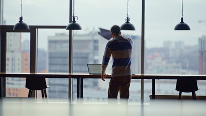 Fototapeta premium Entrepreneur disappointed work fail glass walls office. Stressed man problem