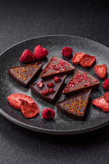 Craft home made chocolate with berries and fruits, delicious sweets. Craft chocolate