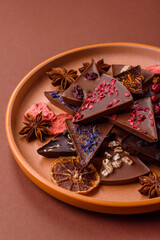 Craft home made chocolate with berries and fruits, delicious sweets. Craft chocolate