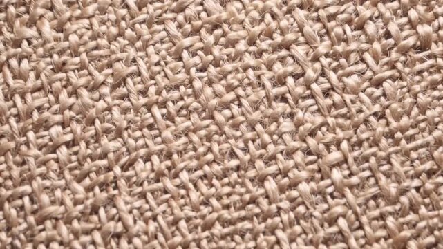 close up top view of light beige sepia canvas texture background made of natural cotton burlap fabric