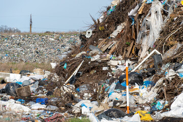 Littered landscape at a waste site reveals the extent of environmental pollution and human impact on nature
