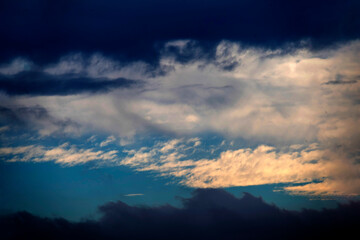 Dramatic clouds against a bright blue sky