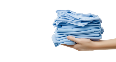 A hand is holding a stack of blue towels