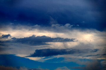 Dramatic cloudscape with glimpses of ligh in sky