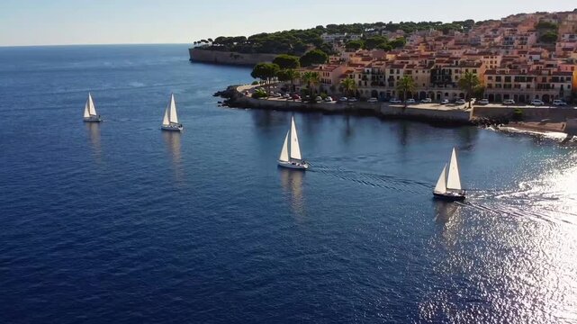 Seafaring Vessels Navigating the Azure Waters of Inland Sea Near Shoreline with Tropical Flora