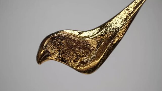 abstract artistic background with brushstroke effect in gold glitter on white base