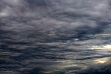 Obraz premium Dramatic cloudscape with glimpses of ligh in sky