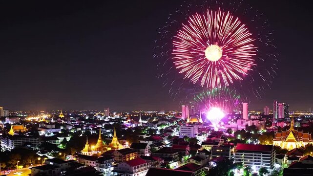 Festive New Year Fireworks Display Illuminating the Night Sky Over Urban Cityscape
