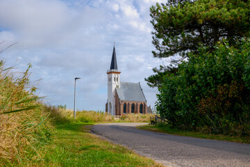 Typical landscape of Texel island with small village and picturesque church (Hervormde kerk) under...