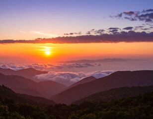 Fototapeta premium Sunrise over misty mountains